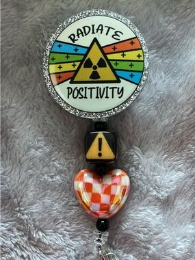 Radiate Positivity Rainbow Badge Reel with Checker Heart